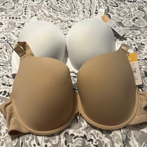 Two t-shirt bras, one white and one tan